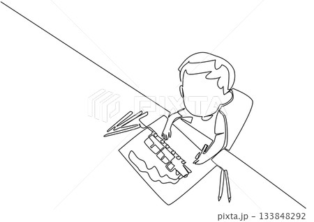 Single one line drawing a boy drawing a train and colorful pencils scattered around. Painting a train. Favorite vehicle. Imagination. Idea. Drawing Day. Continuous line design graphic illustration 133848292