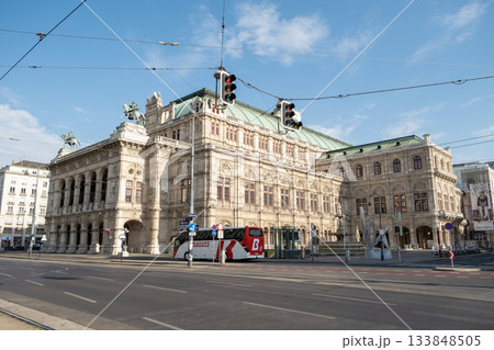 The Vienna State Opera House seen from a street corner, featuring its grandeur and neoclassical design 133848505