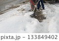 Clearing Snow From Sidewalk During Cold Winter Weather 133849402