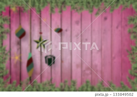 Blurred fir tree branches on wood Blurred fir tree branches on wood 133849502