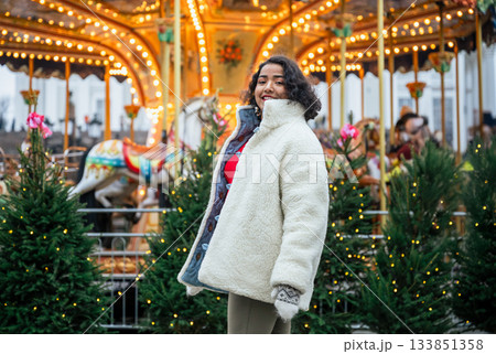 indian woman standing by christmas carousel at senate square helsinki indian woman standing by christmas carousel at senate square helsinki 133851358