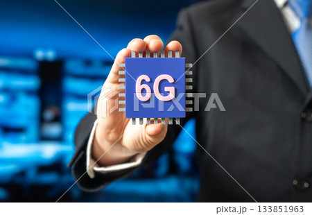 A businessman holds a 6G electronic chip. A new standard in communications technology. Network modernization. Technology news, telecom innovation, and the evolution of high-speed connectivity. 133851963