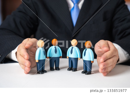 A businessman retains his employees. Team insurance. Mentoring and support. Corporate culture development, employee wellbeing and long-term talent management. 133851977