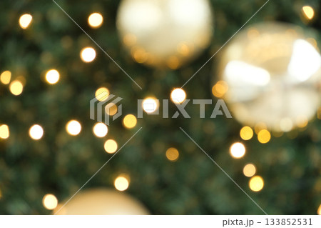 Festive Christmas Bokeh Background with Golden Ornaments and Sparkling Lights. Festive Christmas Bokeh Background with Golden Ornaments and Sparkling Lights. 133852531