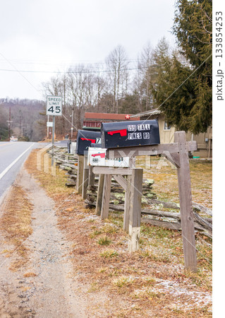 A row of mailboxes with one that says "We're Fine" on it A row of mailboxes with one that says "We're Fine" on it 133854253