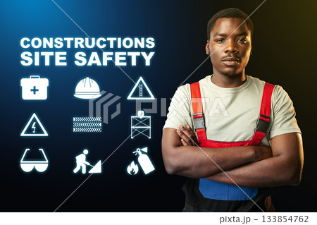 Construction worker promotes safety awareness at a job site with informative symbols 133854762