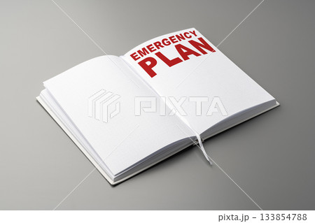 Emergency plan written in a notebook with clear text on a gray background 133854788