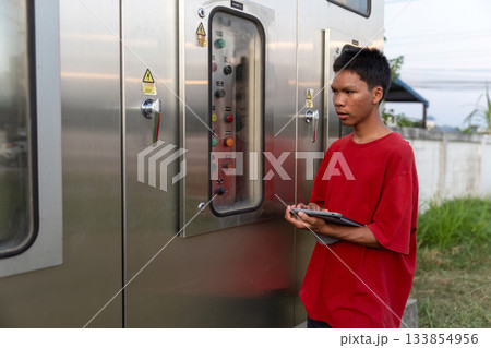 Electrical engineer working in control room. Electrical engineer working in control room. 133854956