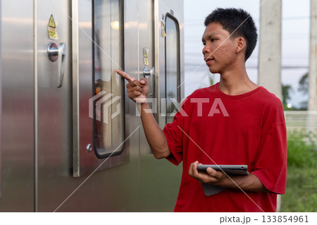 Electrical engineer working in control room. Electrical engineer working in control room. 133854961
