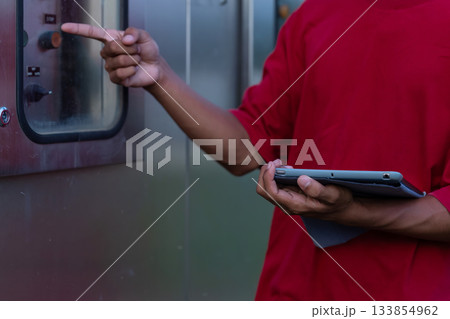 Electrical engineer working in control room.  133854962