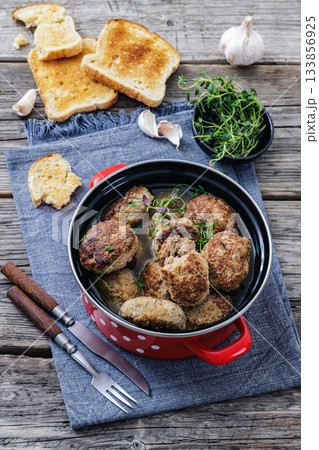 Frikadellen, Minced Meat Patties in a red pot Frikadellen, Minced Meat Patties in a red pot 133856925