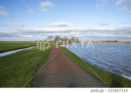 Flooded meadow scene at Eemnes pumping station in Eempolder, Netherlands during a clear day Flooded meadow scene at Eemnes pumping station in Eempolder, Netherlands during a clear day 133857114