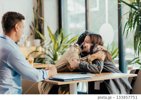 College Friends Meet and Hug at University Cafeteria During Lunch Break College Friends Meet and Hug at University Cafeteria During Lunch Break 133857751
