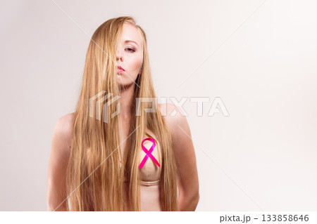 Woman chest in bra, pink cancer ribbon Woman chest in bra, pink cancer ribbon 133858646