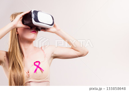 Girl in bra pink cancer ribbon and vr box Girl in bra pink cancer ribbon and vr box 133858648
