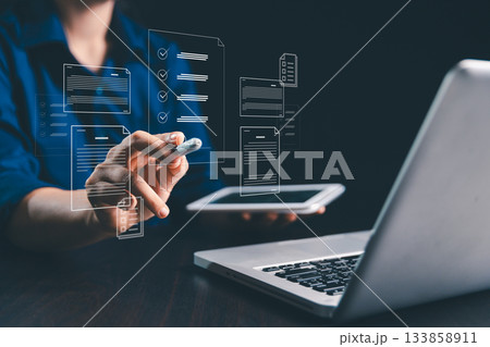 Businesswoman is signing electronic documents on virtual screen, using digital technology to manage online contracts and streamline document management in modern business operations. 133858911