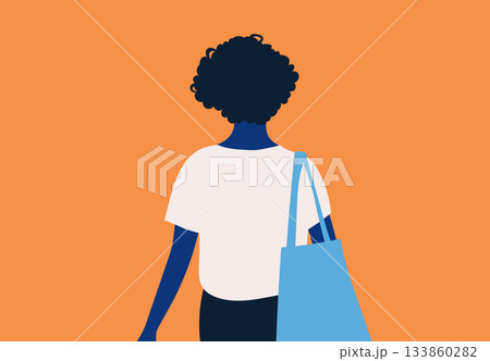 Rear view of a person with curly hair carrying a blue tote bag on an orange background. 133860282