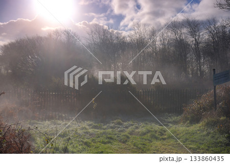 Beautiful sunny and cold December morning in the south west, UK. Low lying mist being slowly burnt back by bright autumn, winter sunshine Beautiful sunny and cold December morning in the south west, UK. Low lying mist being slowly burnt back by bright autumn, winter sunshine 133860435