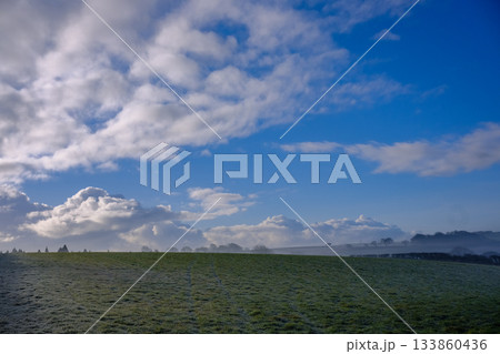 Beautiful sunny and cold December morning in the south west, UK. Low lying mist being slowly burnt back by bright autumn, winter sunshine 133860436