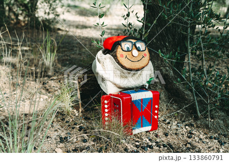 a Tio de Nadal with glasses in the forest 133860791