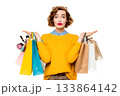 A person is holding many shopping bags filled with beauty products. 133864142
