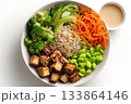Vegan tofu bowl with broccoli, carrots, edamame, and rice is served. 133864146
