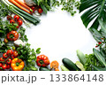 Fresh vegan vegetables and herbs arranged in a border. 133864148