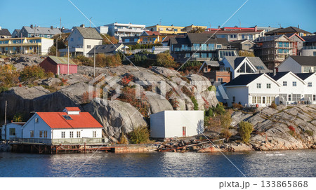 A serene coastal town scene featuring wooden houses, Kristiansund A serene coastal town scene featuring wooden houses, Kristiansund 133865868