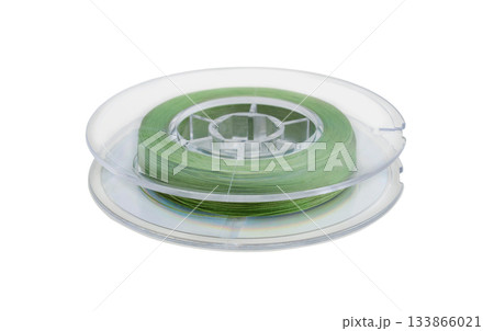 Fishing line on a plastic reel isolated on white. Fishing line on a plastic reel isolated on white. 133866021