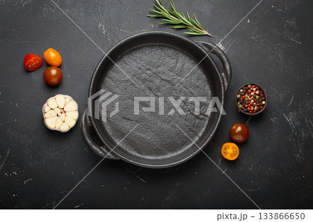 Cast black empty iron cooking pan fresh ingredients cooking healthy copy space 133866650