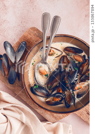 Mussels in creamy garlic sauce, served with fresh herbs and spices, homemade, no people, 133867894