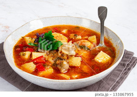 Souzi soup. Georgian dish, meat with oats, tomato sauce and herbs, 133867955