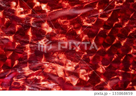 Vibrant red abstract texture with crystal-like facets and metallic glare 133868659