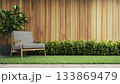 Modern Gray Chair And Empty Wood Plank Wall Adorn This Wooden Terrace With Green Lawn Rendering 133869479