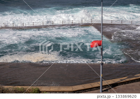 Red flag on the Atlantic ocean beach, Tenerife, Spain 133869620