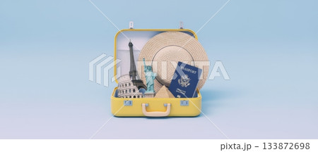 Yellow open suitcase packed with a passport, straw hat, and famous landmarks like the eiffel tower, statue of liberty, colosseum, and pyramid, symbolizing global tourism and vacation planning 133872698