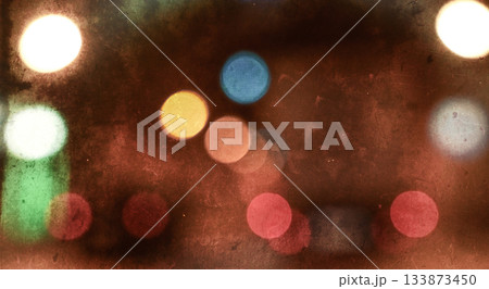 Colorful vintage bokeh background with film scratches and grain Colorful vintage bokeh background with film scratches and grain 133873450