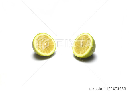 Whole Green Lemon , half and slice, isolate on white background with clipping paths. Whole Green Lemon , half and slice, isolate on white background with clipping paths. 133873686