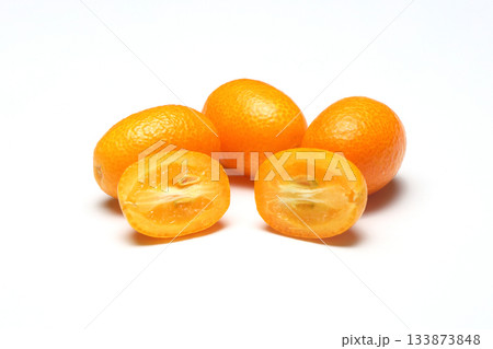 Fresh ripe kumquats on white background, top view. Exotic fruit 133873848