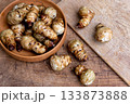 Fresh Sliced Jerusalem Artichokes on Wooden Cutting Board 133873888