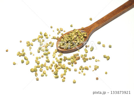 Oregano in the wooden spoon isolated on a white background. 133873921