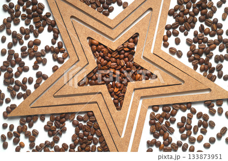 Roasted coffee beans shaping star on white background. 133873951