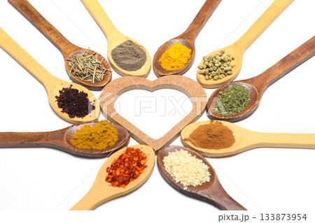 Different kind of spices on a white background. Oriental spices in spoons, red peppers, curry powder, cinnamon powder, mint powder, sumac, sesame, black cumin, 133873954