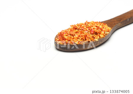 red ground paprika powdered or dry chili pepper with wooden spoon isolated on white background red ground paprika powdered or dry chili pepper with wooden spoon isolated on white background 133874005