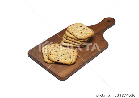 Pile of crackers with different seeds isolated on white background. Pile of crackers with different seeds isolated on white background. 133874036
