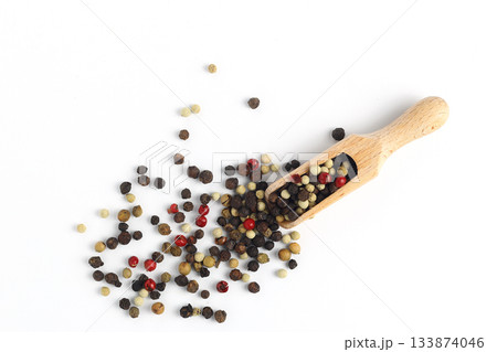 Pepper mix in scoop isolated on white background, top view Pepper mix in scoop isolated on white background, top view 133874046