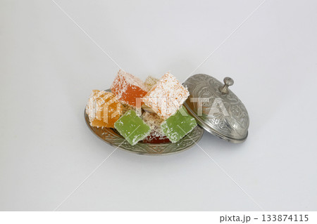 Turkish delight dessert in plate on white background Turkish delight dessert in plate on white background 133874115