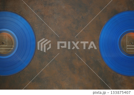 Aged black paper cover and vinyl LP record isolated on black background Aged black paper cover and vinyl LP record isolated on black background 133875407