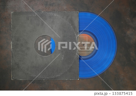 Aged black paper cover and vinyl LP record isolated on black background Aged black paper cover and vinyl LP record isolated on black background 133875415