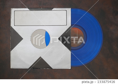 Aged black paper cover and vinyl LP record isolated on black background Aged black paper cover and vinyl LP record isolated on black background 133875416